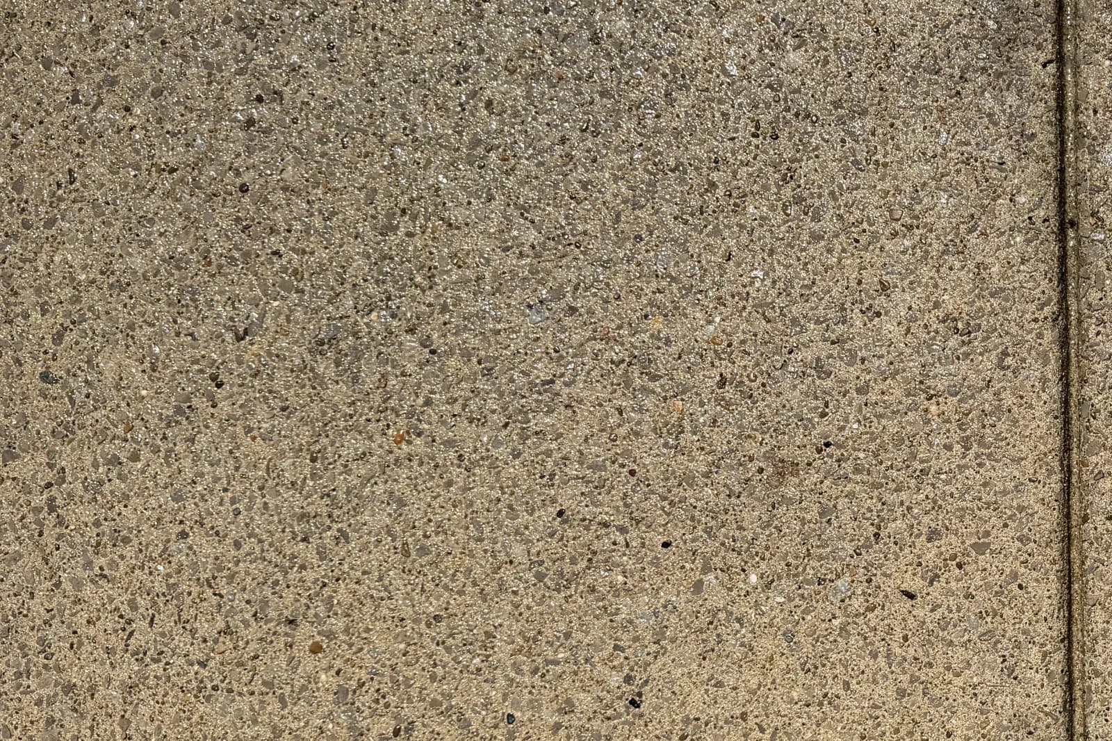 Driveway concrete after pressure washing with stains removed.