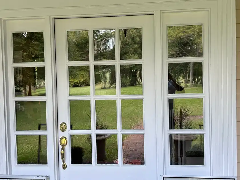Residential glass doors shining after exterior window cleaning.