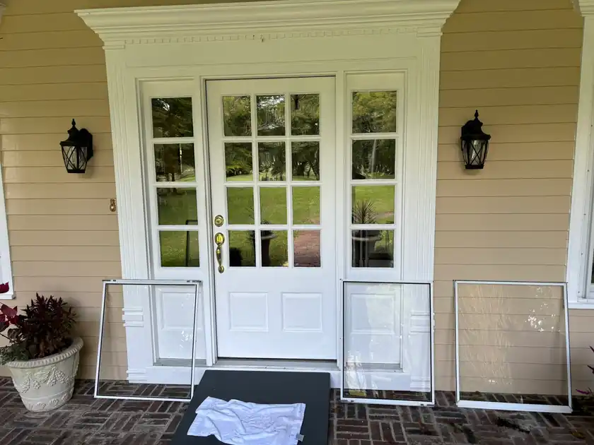 Residential glass doors before exterior window cleaning.
