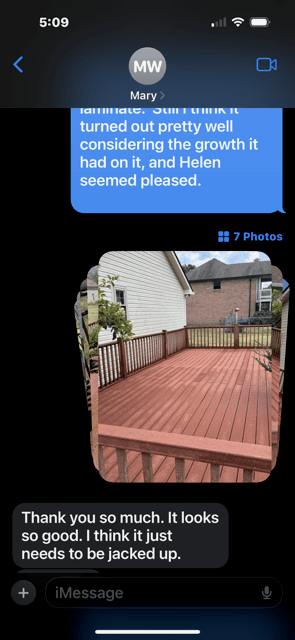 Customer text message showing a restored deck and saying it looks very good