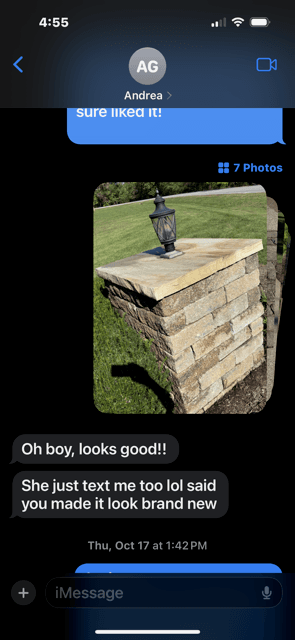 Customer text message showing a cleaned stone column and saying it looks brand new